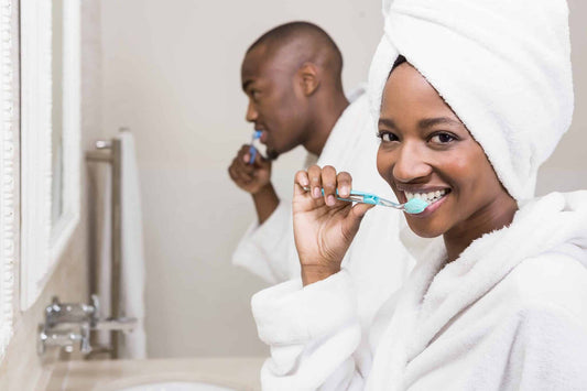 Couple brushing their teeth