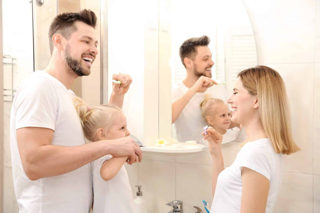 Family brushing their teeth